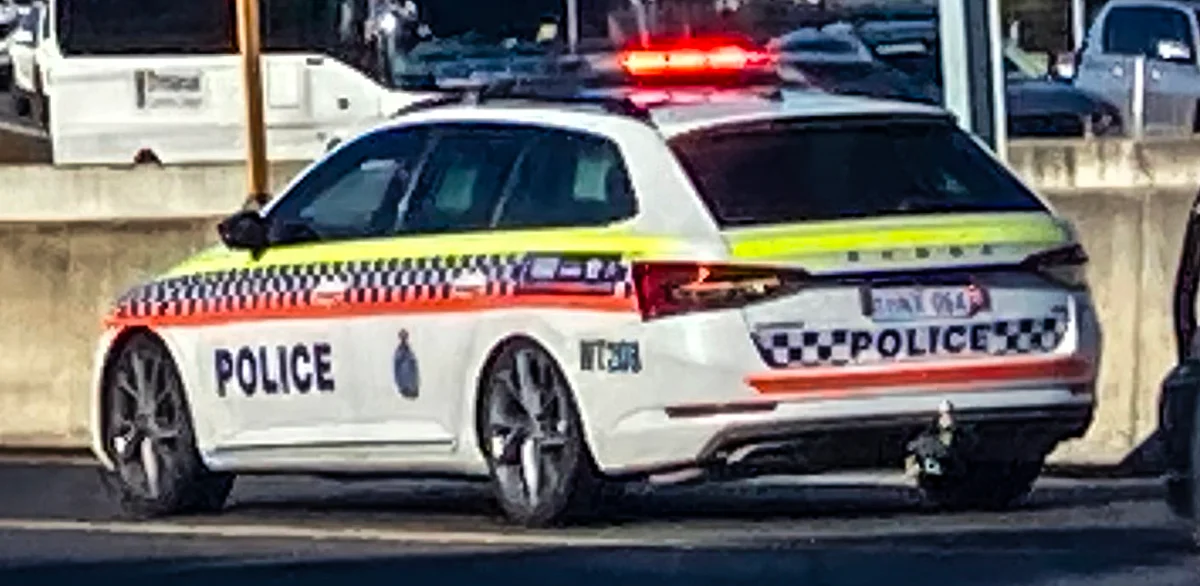 A WA Police Skoda patrol car with lights on